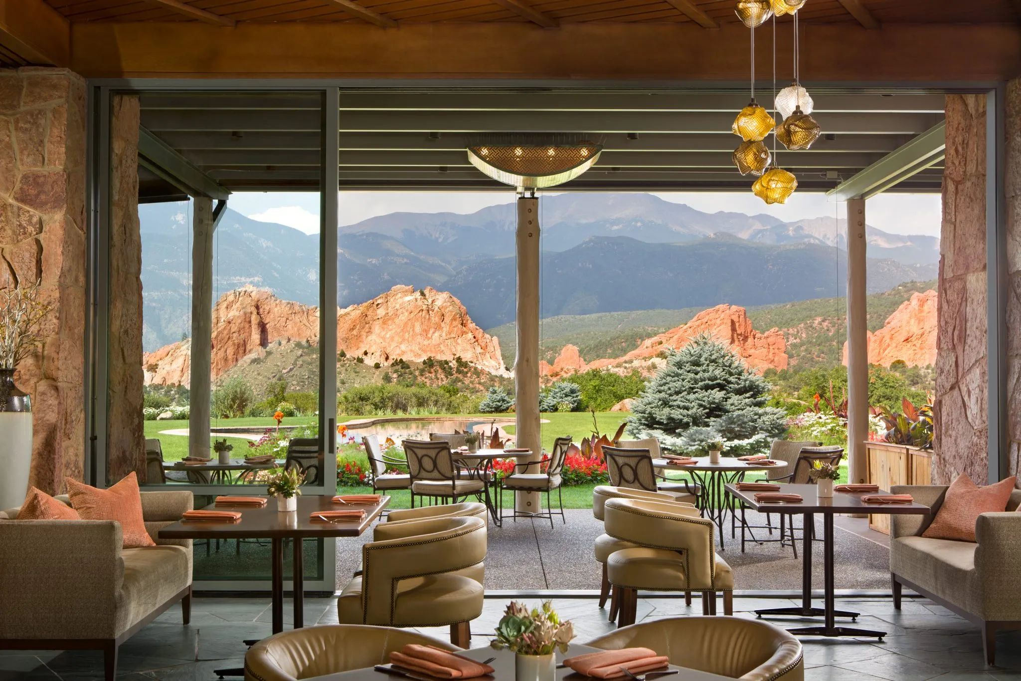 a dining area with a large window showing a mountain view