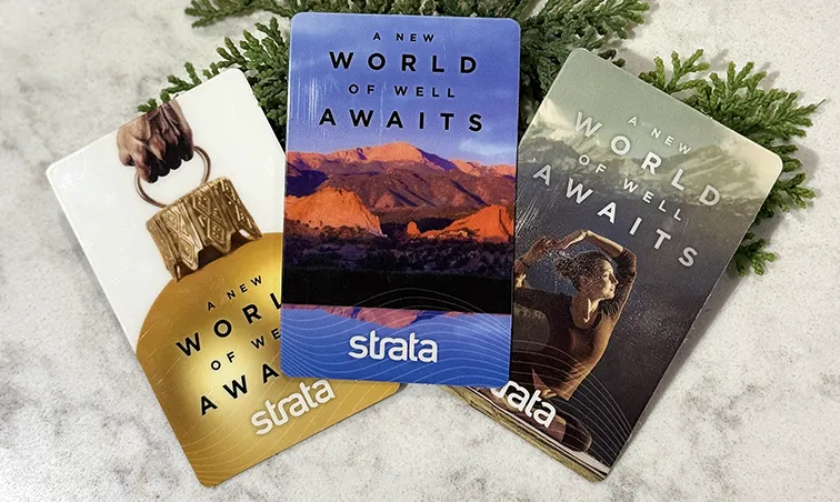 strata med giftcards laying on a table nicely displayed for the holidays